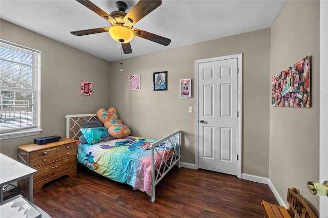 bedroom featuring ceiling fan and dark hardwood / wood-style flooring