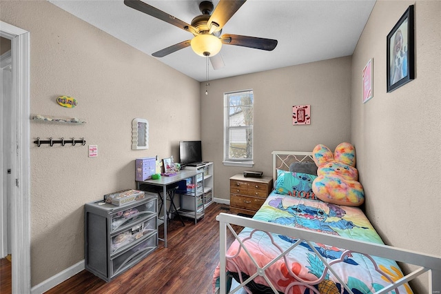 bedroom featuring ceiling fan and dark hardwood / wood-style floors