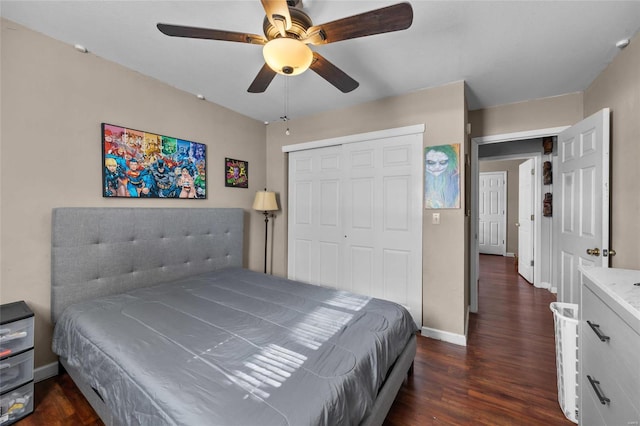 bedroom featuring ceiling fan, a closet, and dark hardwood / wood-style floors