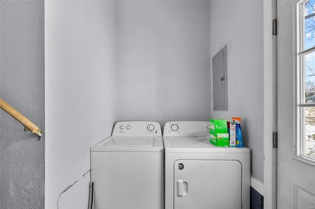 laundry area with separate washer and dryer and electric panel