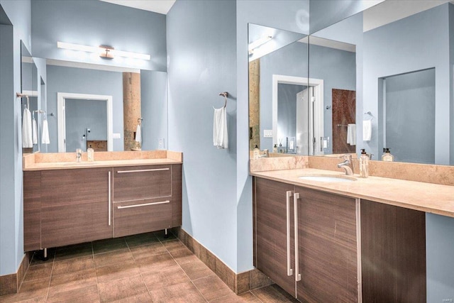 bathroom with tile patterned flooring and vanity