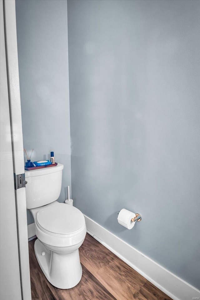 bathroom featuring toilet and hardwood / wood-style flooring