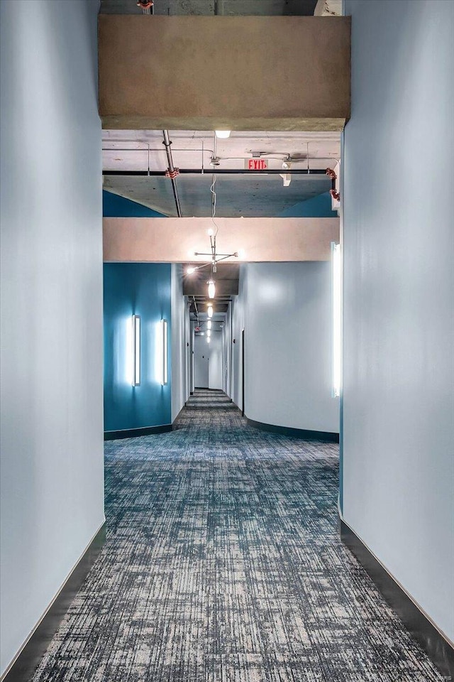 hallway featuring a towering ceiling