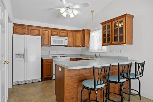 kitchen featuring kitchen peninsula, white appliances, vaulted ceiling, ceiling fan, and sink