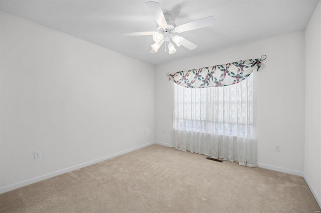 carpeted empty room with ceiling fan