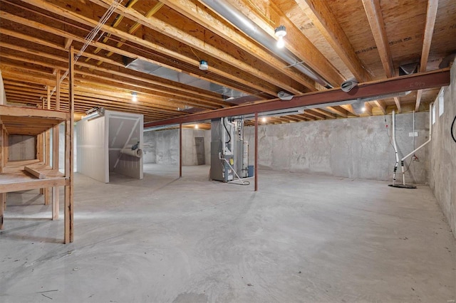 basement featuring heating unit