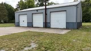 garage featuring a lawn