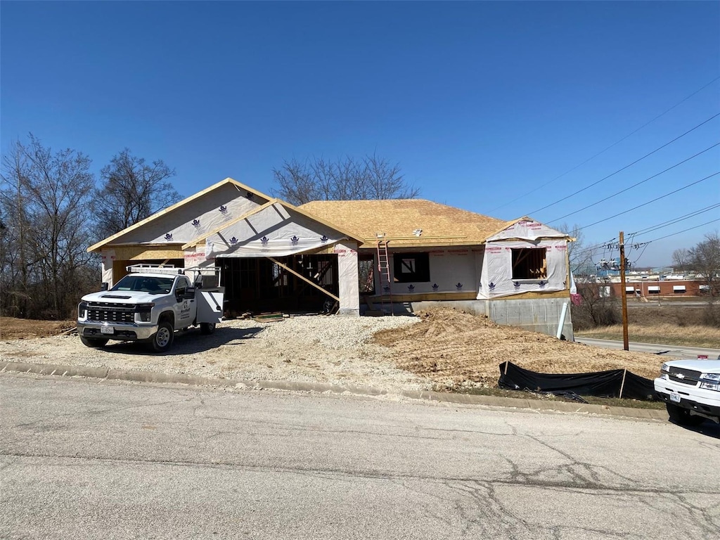 property in mid-construction with a garage