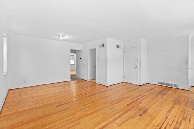 unfurnished room with light hardwood / wood-style floors