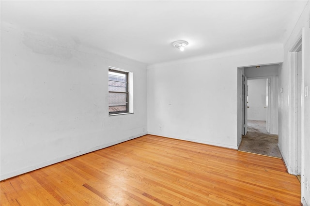 spare room featuring light wood-type flooring