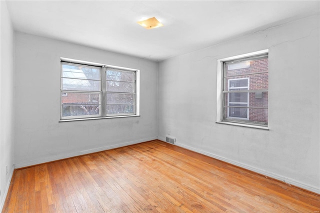 unfurnished room featuring light hardwood / wood-style flooring