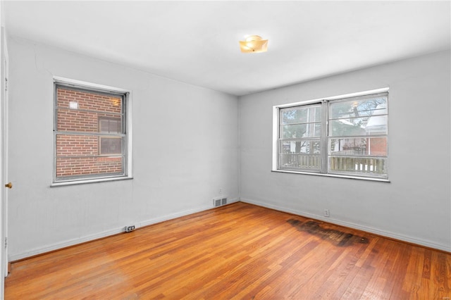 spare room featuring hardwood / wood-style flooring