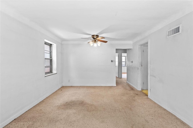 spare room with ceiling fan