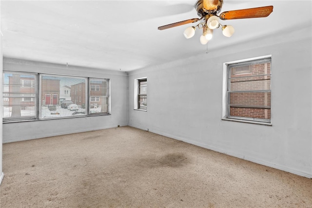 empty room featuring ceiling fan