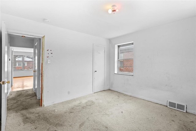 unfurnished room with carpet floors