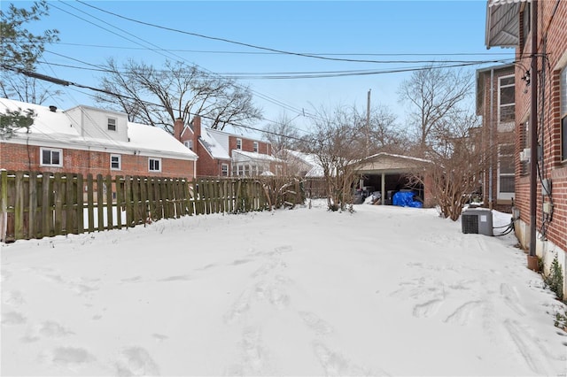 view of yard layered in snow