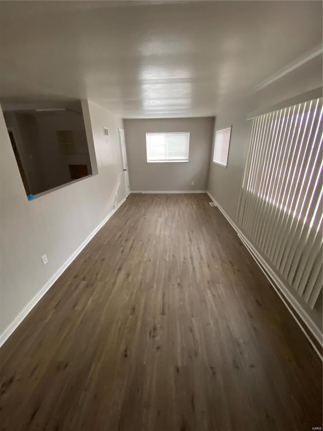 unfurnished room with dark hardwood / wood-style floors