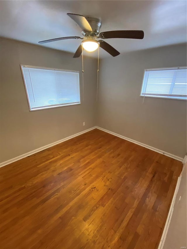 empty room with hardwood / wood-style flooring