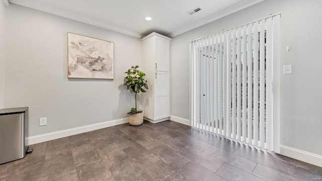 unfurnished room featuring ornamental molding