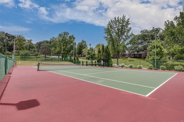 view of sport court with basketball hoop