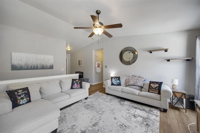 living room with vaulted ceiling, ceiling fan, and light hardwood / wood-style floors