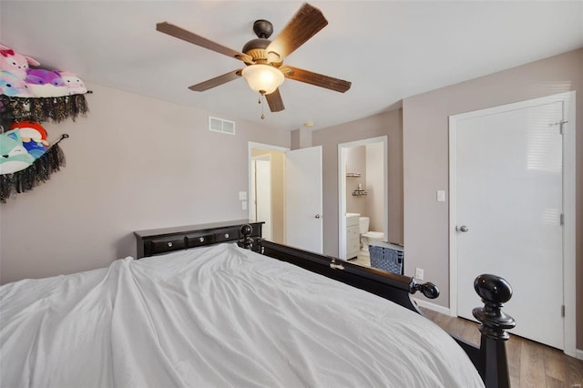 bedroom featuring ensuite bathroom, ceiling fan, and light hardwood / wood-style flooring