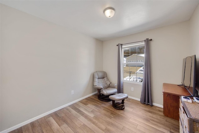 living area with light hardwood / wood-style floors