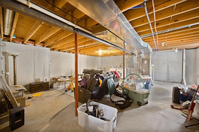 basement featuring electric panel and washer / dryer