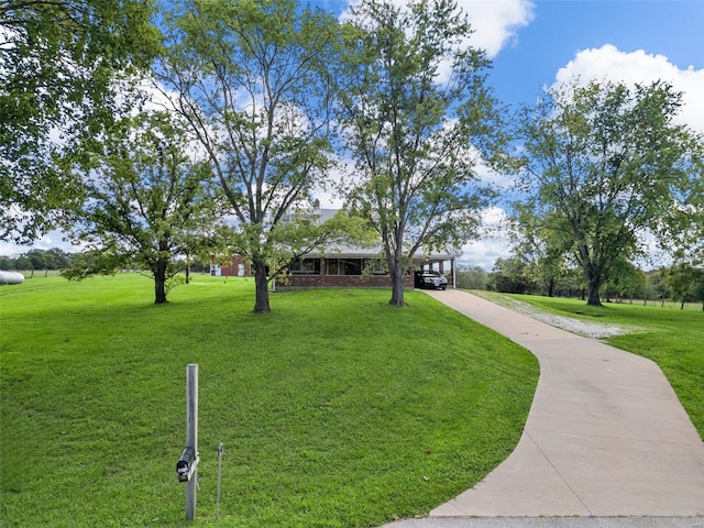 view of property's community featuring a yard