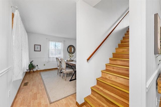 staircase featuring wood-type flooring