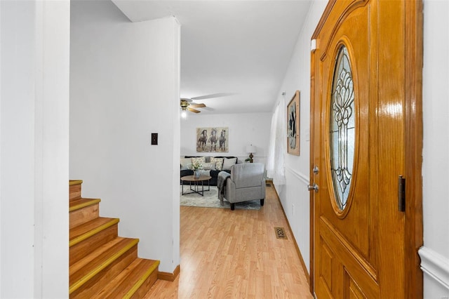 entryway featuring light wood-type flooring and ceiling fan