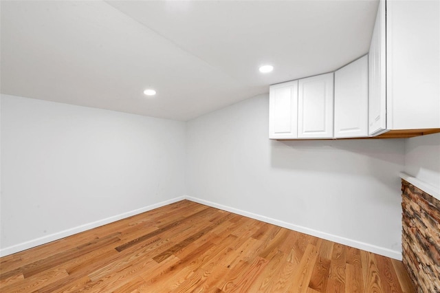 basement featuring light hardwood / wood-style floors