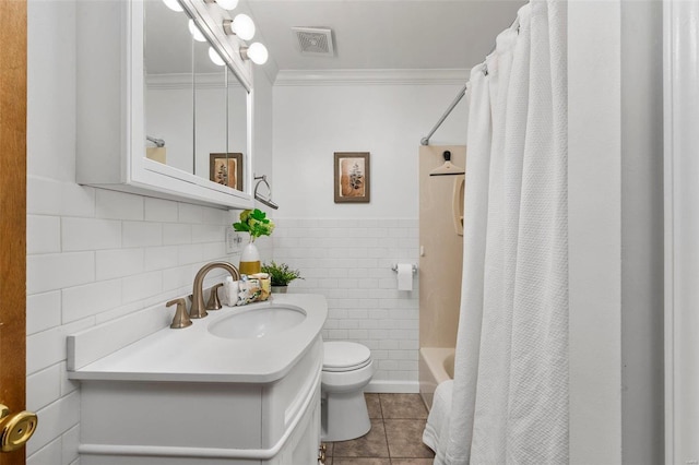 full bathroom featuring toilet, shower / bath combo with shower curtain, tile walls, tile patterned floors, and ornamental molding