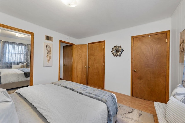 bedroom with light wood-type flooring