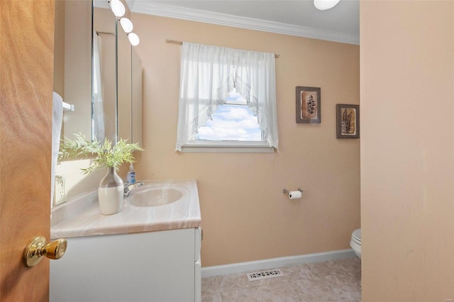 bathroom featuring ornamental molding, toilet, tile patterned floors, and vanity