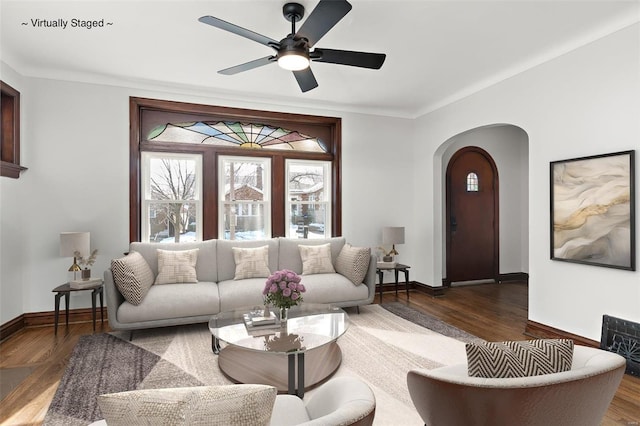 living room with ceiling fan and dark hardwood / wood-style flooring