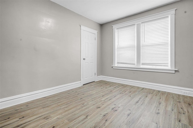 spare room featuring light wood-type flooring