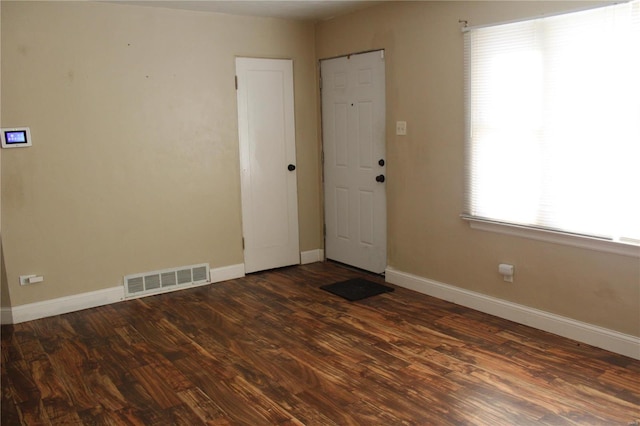 empty room featuring dark hardwood / wood-style floors