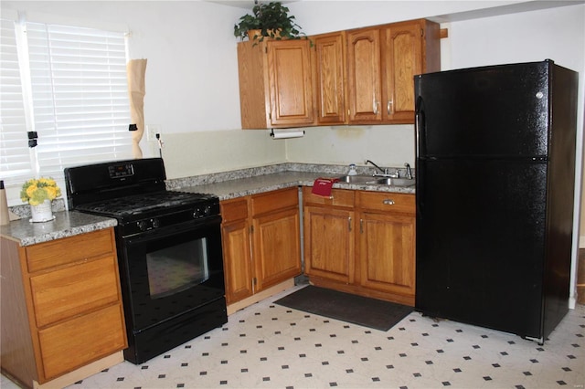 kitchen featuring black appliances and sink