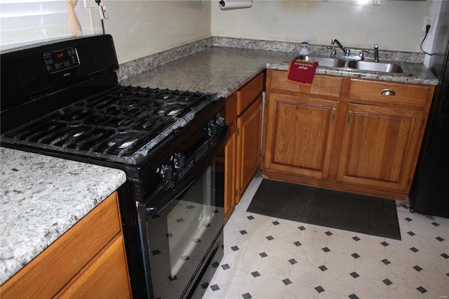 kitchen with black appliances and sink