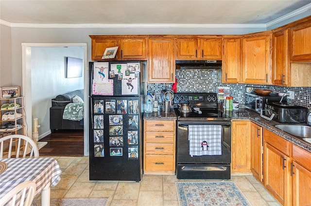 kitchen with black appliances, ornamental molding, dark stone counters, and tasteful backsplash