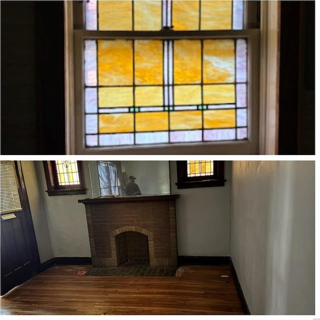 unfurnished living room with dark wood-type flooring and a brick fireplace