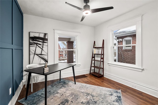 office area with ceiling fan, a wealth of natural light, and wood-type flooring