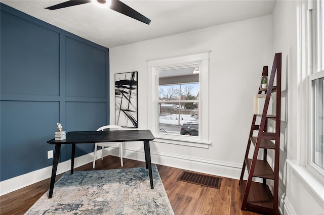 home office featuring ceiling fan and hardwood / wood-style floors