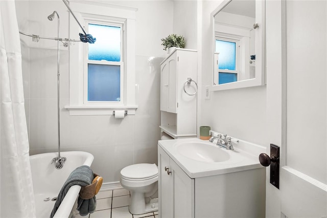 full bathroom with shower / bath combination with curtain, toilet, vanity, and tile patterned flooring