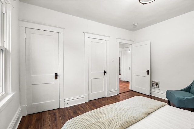 bedroom featuring dark hardwood / wood-style flooring