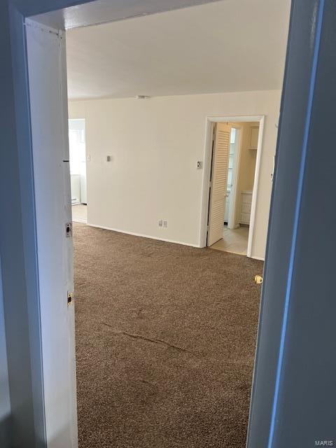 unfurnished room with carpet floors