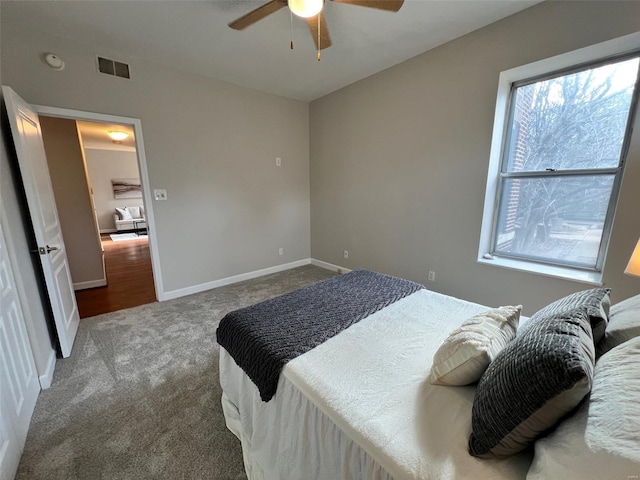 carpeted bedroom with ceiling fan