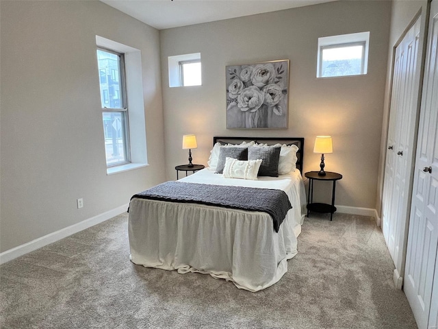 bedroom with carpet flooring and a closet