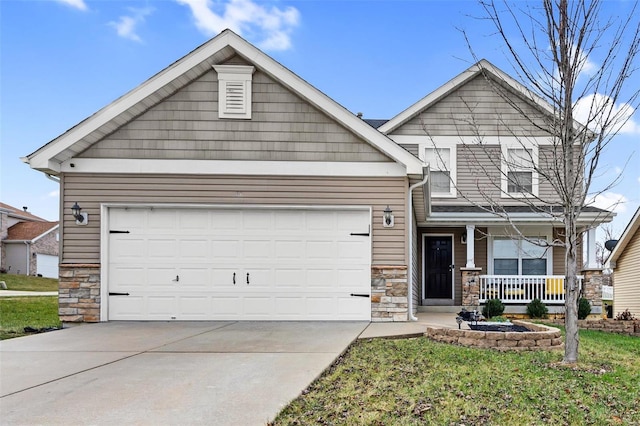 craftsman-style home with a porch, a front lawn, and a garage